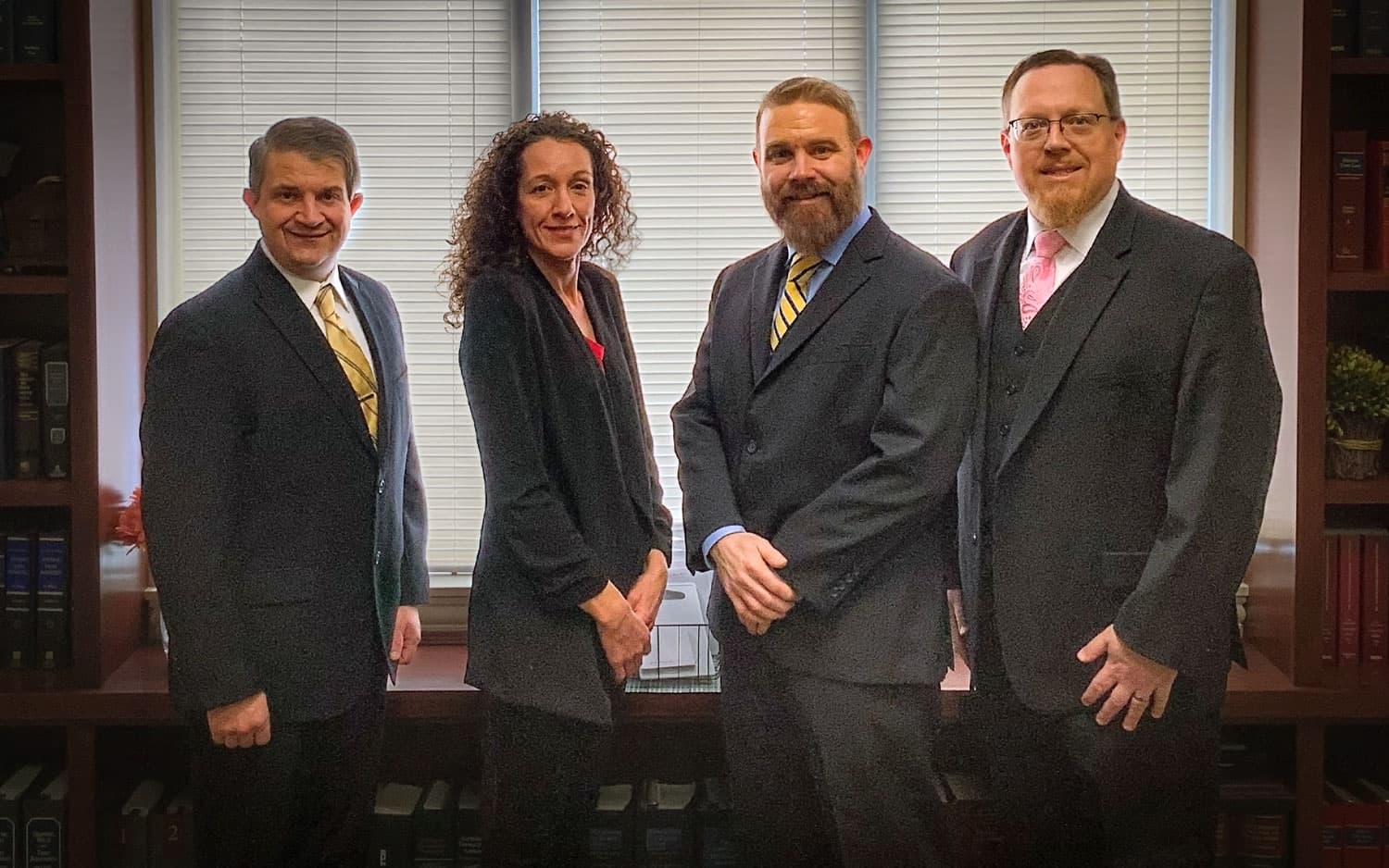 Group of attorneys from left to right: Chris Minelli, Julie Merenda, Mike Brady, and Dale Hauser